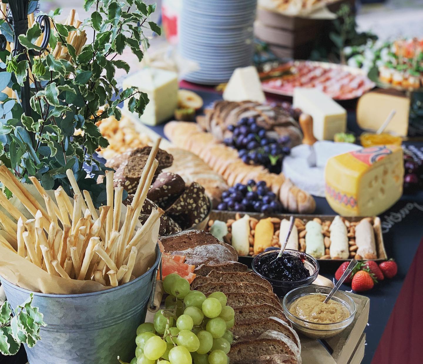 A Carr’s grazing table with breads, cheese, and fruit